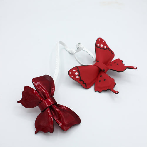 Bijou de sac – Cuir rouge papillons